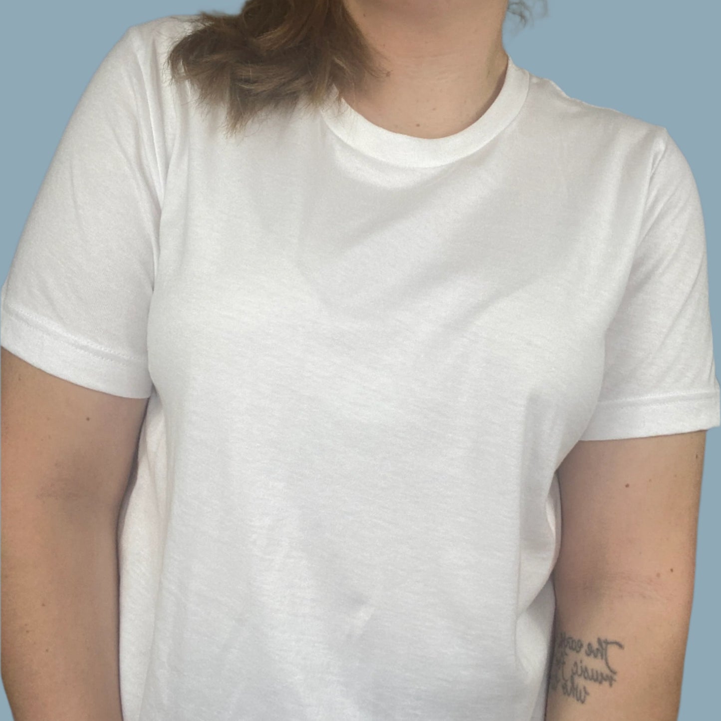 White shirt with the Shed The Bullshit design with blue areas that look faded in and out