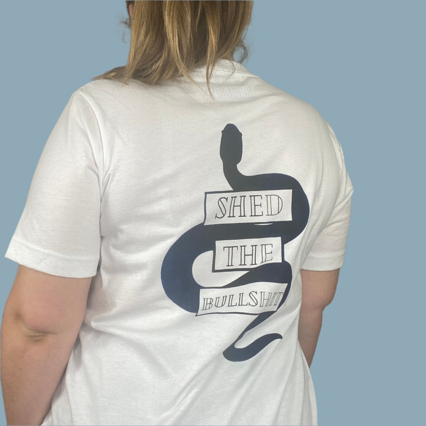 White shirt with the Shed The Bullshit design with blue areas that look faded in and out