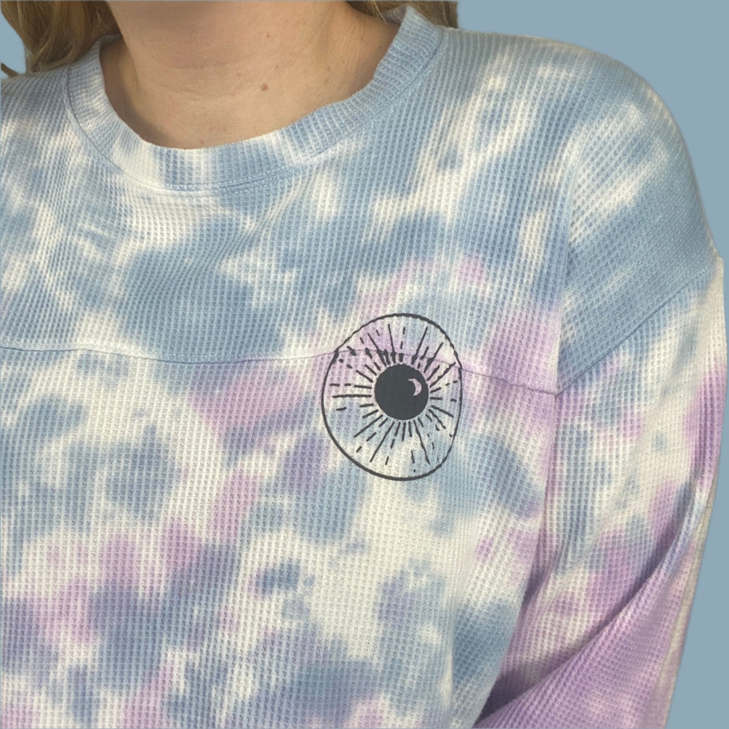light blue, lilac and white tie dyed thermal with inner thoughts prints on the front and back