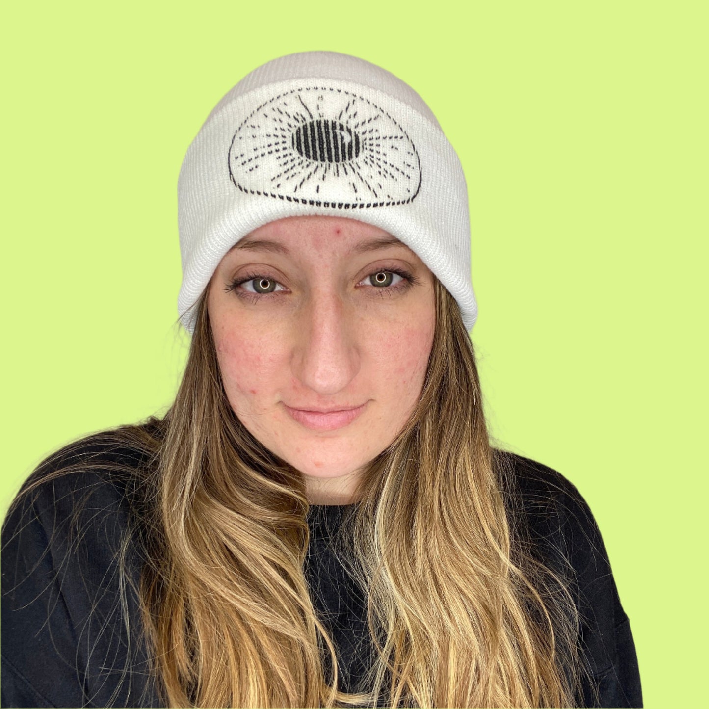white Beanie with Night Sky Print on front fold being worn