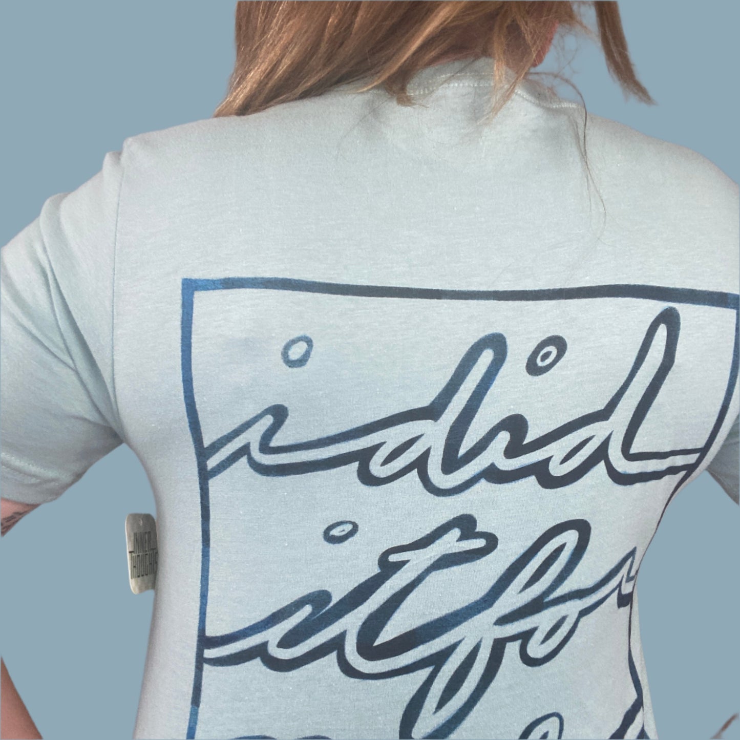 dusty blue shirt with I Did It For Me print on the back with a blue fade look within the design