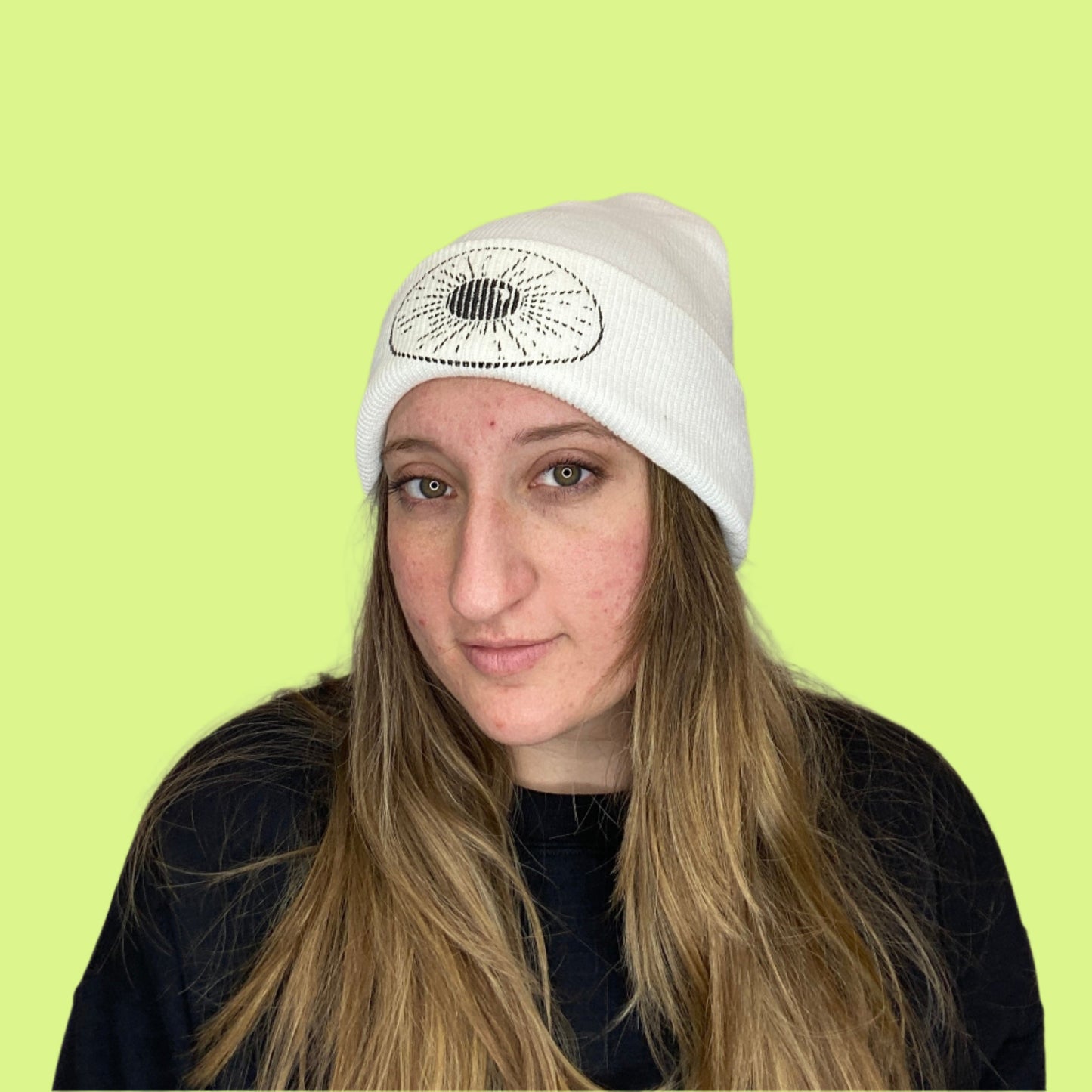 white Beanie with Night Sky Print on front fold being worn