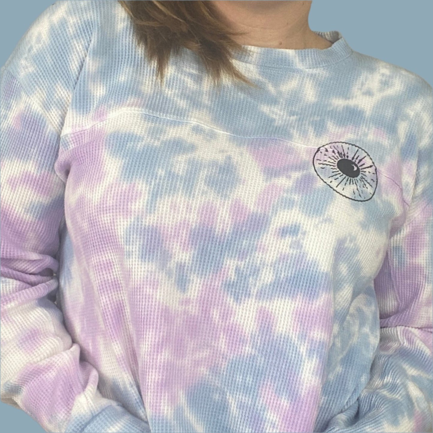 light blue, lilac and white tie dyed thermal with inner thoughts prints on the front and back