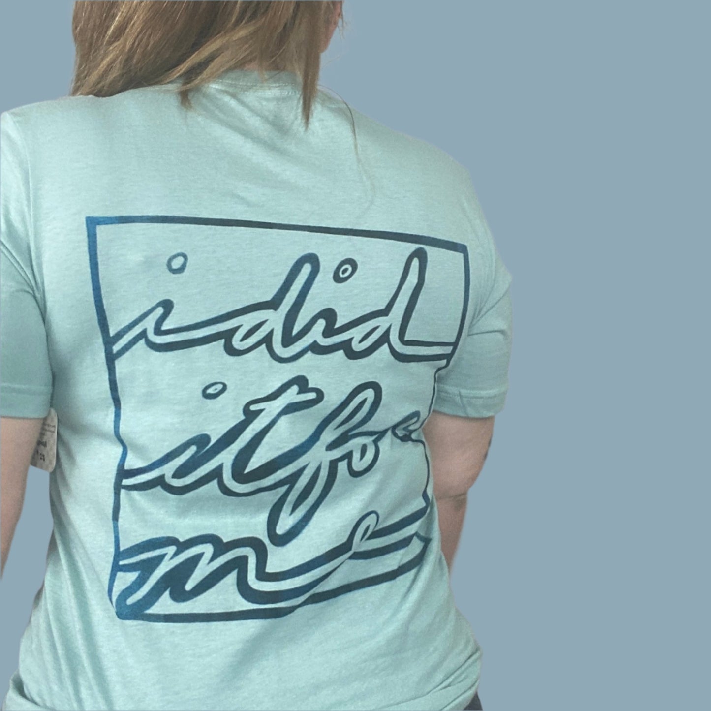 dusty blue shirt with I Did It For Me print on the back with a blue fade look within the design
