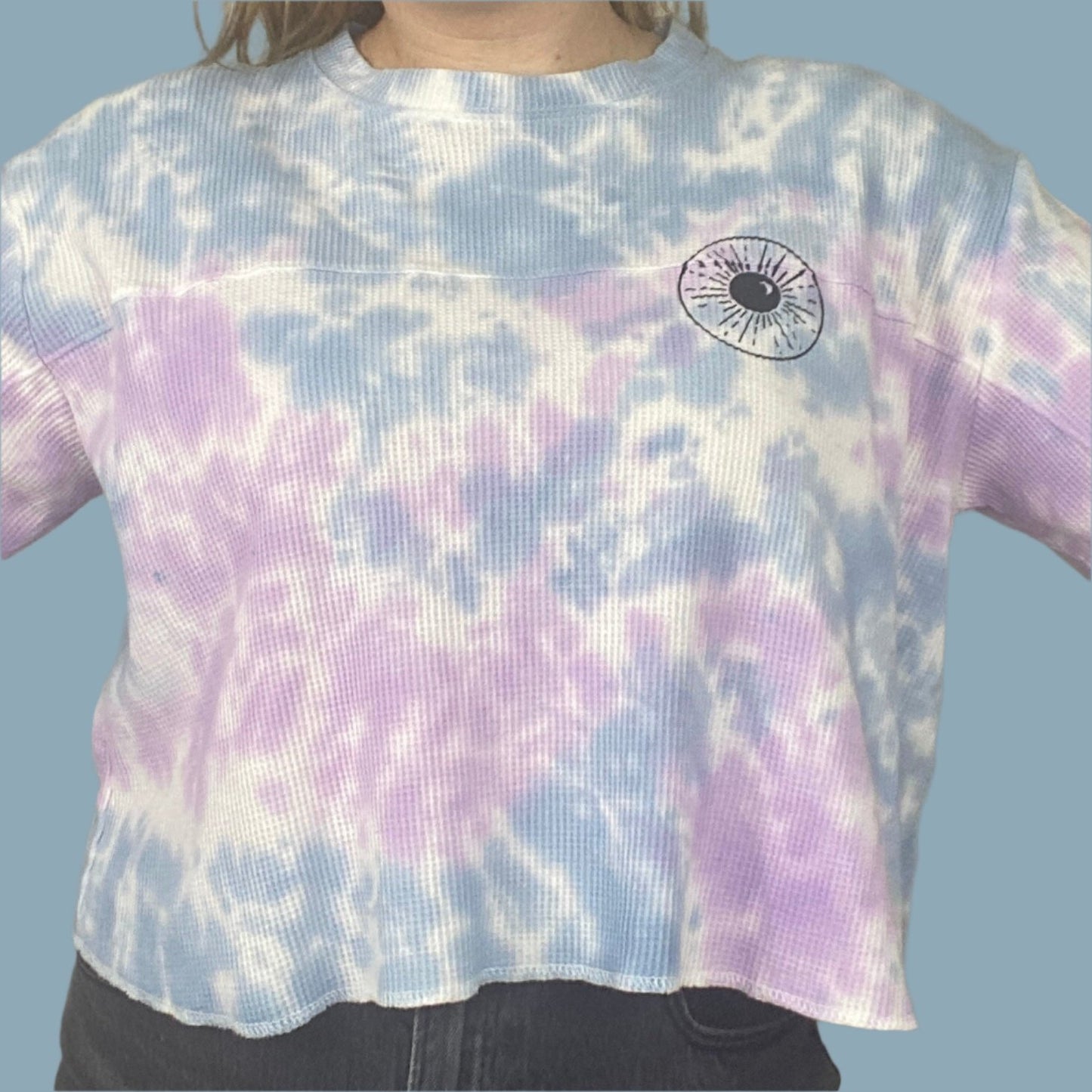 light blue, lilac and white tie dyed thermal with inner thoughts prints on the front and back