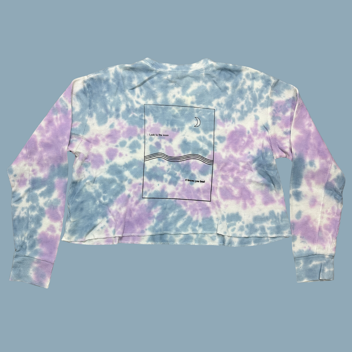 light blue, lilac and white tie dyed thermal with inner thoughts prints on the front and back