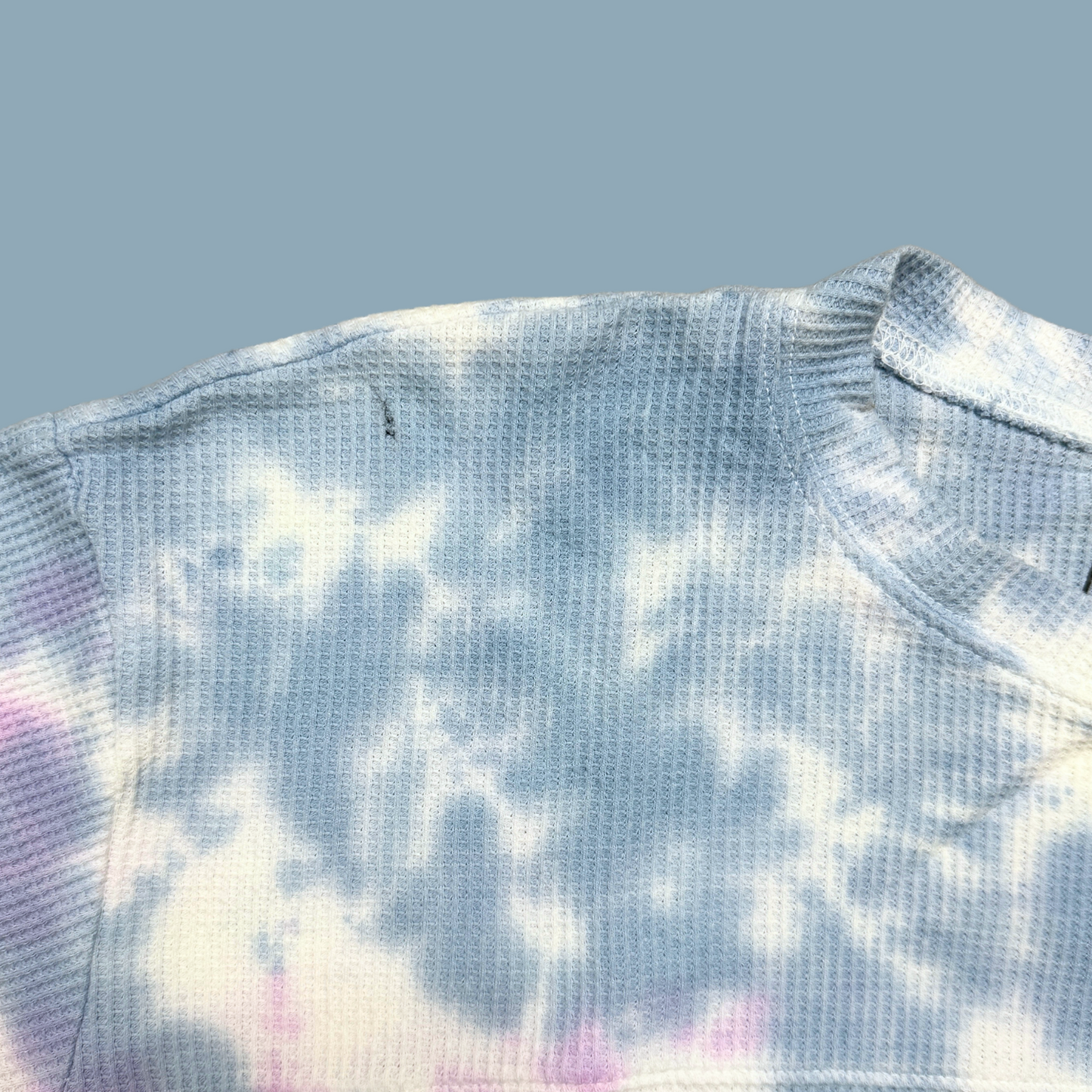 light blue, lilac and white tie dyed thermal with inner thoughts prints on the front and back