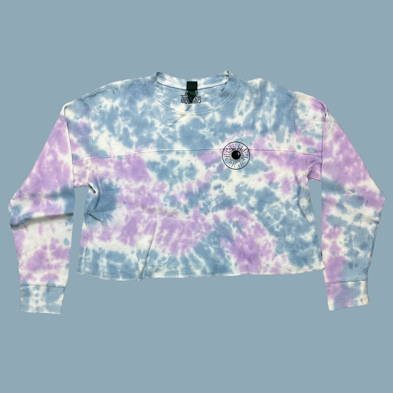 light blue, lilac and white tie dyed thermal with inner thoughts prints on the front and back